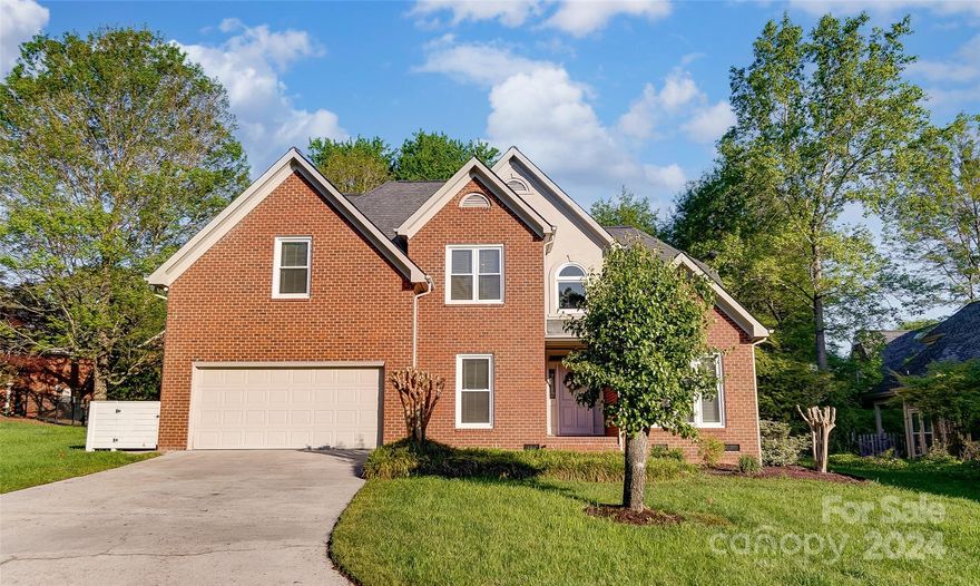 Hard to find a full brick home on a large private lot but here is your chance. Backyard is wooded offering a producing Fig Tree, large patio and deck which offers a great spot for entertaining.  This property is within steps of the community center and community pool, located in the award winning school district of Fort Mill.. There have been several updates in the last 5 years, HVAC, all windows replaced, Primary suite has fully renovated bathroom which is also located on the main level, Kitchen backsplash and appliances, half bath vanity, interior paint, outdoor patio, new door and bathroom fixtures, and replacement of commodes. Some other features this beautiful property offers, 2 Story Great Room which is open to kitchen, primary bedroom on main level, hardwood flooring and tile no carpet, minutes from I-77 and uptown Charlotte.