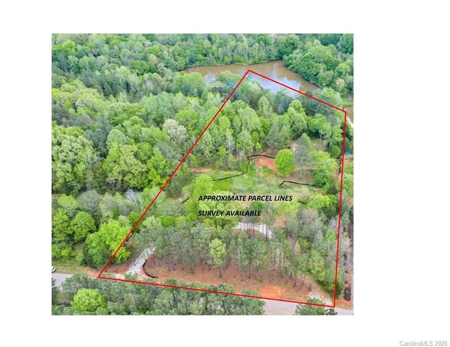 5 Acre Lot located in desirable Van Wyck Community, just down the road from all the new amenities offered in Indian Land on Hwy 521.  Mooreland Wood Community offers estate size lots, a 9 acre community lake, walking and riding trails and several equestrian estates. This lot has the best of both worlds, woods & 3+ acre lake shared with 2 other lots.  Whether looking to clear the lot and plant pasture for horses or keeping the woods, this is an ideal lot to do either.  A large home site has been cleared and graded with a 6 bedrooms septic permit obtained.  Initial gravel circular driveway in place.  Bring your own builder and start dreaming.  While waiting for your new home to be built, enjoy fishing or paddling around in your small lake or the community lake. Mooreland Wood is a conservancy community spanning 206 acres, with only 15 private lots and 57 acres of common property dedicated as a natural habitat.
