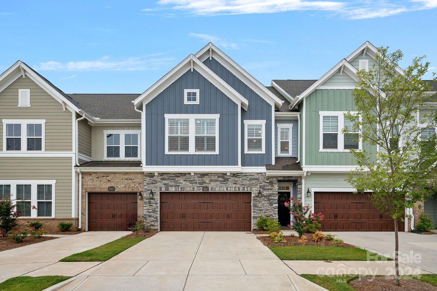 Welcome home to this practically brand-new townhome, with style like that from a magazine.  This beautiful home in The Retreat at Catawba could be your next retreat! This home features neutral tones and designer finishes throughout and abundant natural light.  Upon entering, you will be greeted by the bright, open floor plan with HUGE windows in the main living area overlooking a private fenced patio area. The kitchen is well-appointed with a gas cooktop, marble herringbone backsplash, upgraded appliances, walk-in pantry, and a spacious island with a cast iron farm sink. Enjoy dining, entertaining, relaxing, or putting your culinary skills to the test, all from the open-concept main level. The upper level features 4" plantation shutters in the sunny loft area classic shutters and primary suite with huge walk-in shower, two spacious guest bedrooms, a shared full bathroom, and a large laundry room. Ideal Lake Norman location, & walking distance to many Cornelius & Birkdale amenities!