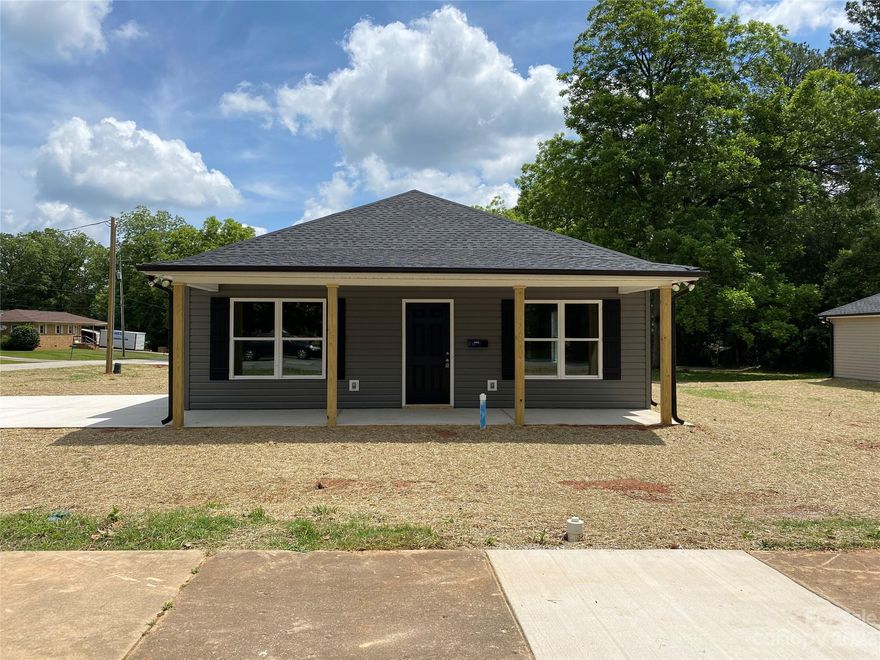 New Construction 3BR/2BA ranch home. 1156 heated square feet. Thoughtfully designed open floor plan with split bedrooms. Interior features luxury vinyl plank flooring throughout. Custom hardwood kitchen cabinet with granite counters. Stainless appliances include range, dishwasher, and microwave. Inside storage includes a coat closet, linen closet, laundry closet, and kitchen pantry. Primary bedroom features a spacious double closet and private bath with enclosed shower. Covered front porch with 190 sq ft, plus covered back porch with 57 sq ft. Level  .26 acre corner lot with side-entry concrete driveway. 100% financing for qualified buyers. Listing agent is owner.