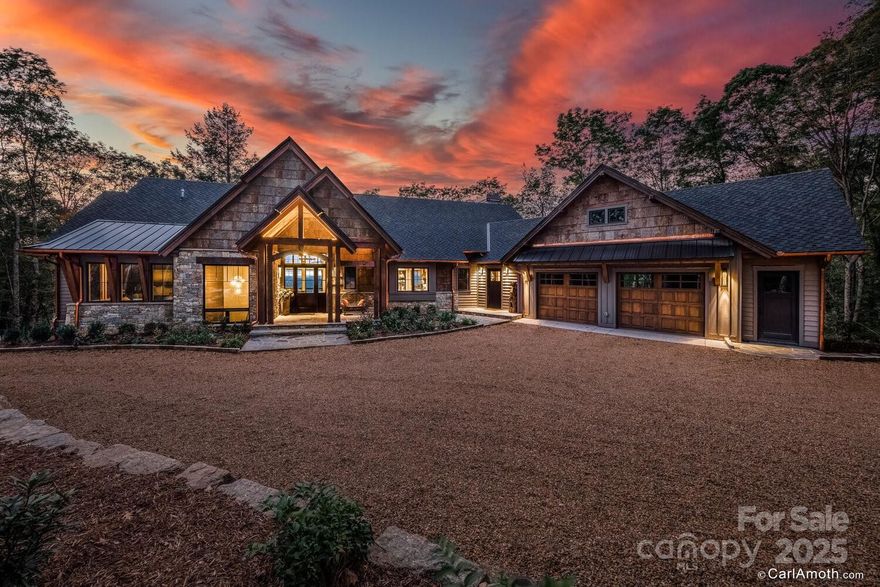 This stunning, custom home has everything you want in a mountain retreat: high elevation, layered Western views, and space for entertaining. The open floor plan features a chef's dream kitchen that leads to the incredible covered porch with a built-in grill, wood burning stone fireplace, and wood dumbwaiter. There are many custom features throughout, including striking custom wood flooring, built-in cabinetry, and timbers in the great room. The primary suite on the main level includes a sitting room/office, walk-in closet, and spacious bath. The lower-level features three bedrooms, three bathrooms, and a generous living room. Just outside you will find a stone patio with a built-in hot tub and fire pit for those cool summer evenings that you will surely have at over 4,500 feet of elevation. Balsam Mountain Preserve is a private 4,400 acre club community with 3,200 acres of conservation land and completed amenities featuring golf, equestrian, scenic trails, tennis and dining.