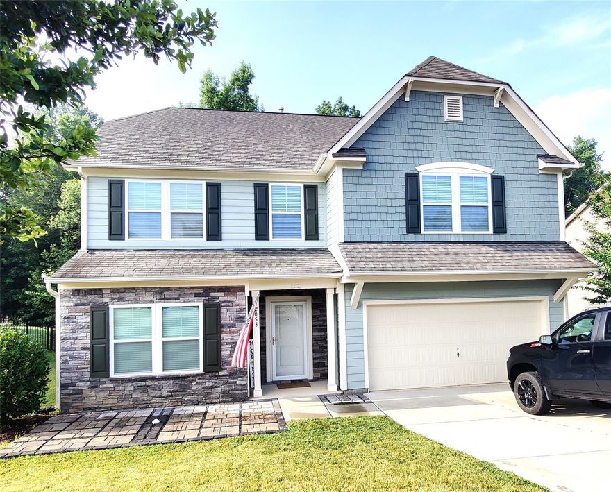 Beautifully maintained home w/ gorgeous wood floors and crown moulding throughout first floor.  Spacious kitchen has huge center island, white shaker cabinets, granite countertop, tile backsplash, stainless steel appliances, ceiling beams, pendant lighting and breakfast nook.  Large butlers pantry between kitchen and dining room includes walk-in pantry.  Elegant chair and picture frame moulding in dining and entry areas.  Spacious living room with floor to ceiling windows is perfect for entertaining.  Second floor features 4 bdrms and loft.  Huge primary bdrm has great natural light, enormous walk-in closet and spa-like bath including double sink vanity w granite countertop, beautiful tile floor, large soaking tub, walk-in shower, and water closet.  Loft is perfect as office or TV room.  Hallway bath has pretty tile floor, double sink vanity, and tub/shower comb.  Laundry room has folding counter.  Fenced back yard w large patio surround by pretty string lighting.  Community pool.