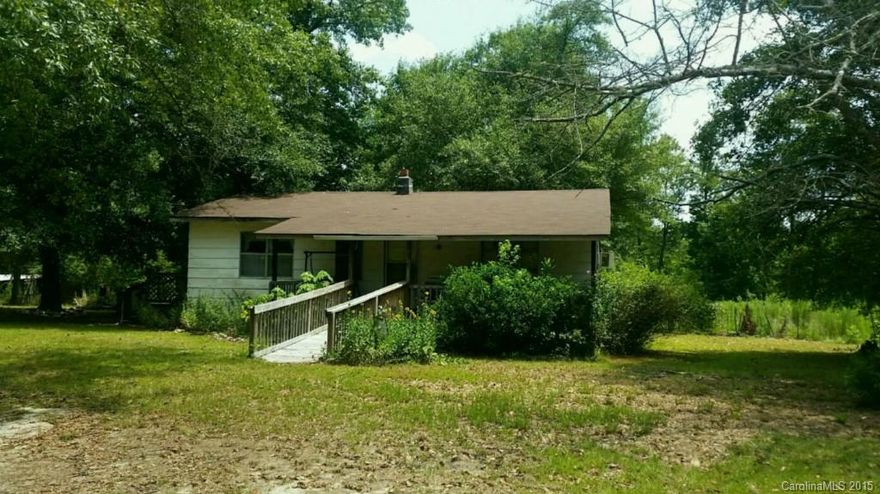 This bungalow is located on a shady 2 acre parcel.  Make this house a home with some updates/renovations.  It features eat in kitchen, living room, two bedrooms and one bath.