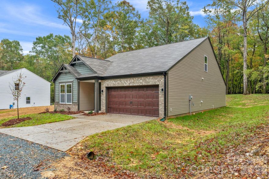 PRICED TO SELL!!! This stunning new construction home sits on 1.1 wooded acres, tucked away off a quiet private drive for the perfect blend of peace and convenience.

Step inside to an open, airy layout that’s ideal for modern living. The main level features a spacious living area filled with natural light, a beautiful kitchen with an oversized island, breakfast area, and a separate dining room—perfect for entertaining. The primary suite and a second main-floor bedroom offer easy access and flexibility for guests or home office needs.

Upstairs, you’ll find two additional bedrooms plus a flex space—ideal for a playroom, gym, or media area. Enjoy quiet mornings or evening gatherings on the covered back porch, overlooking your peaceful wooded surroundings. A large two-car garage provides ample storage and parking.

With no HOA, you’ll have the freedom to enjoy your property your way. Conveniently located just a short drive from Waxhaw, Monroe, and Lancaster, this home offers the perfect mix of seclusion and accessibility.

Experience country charm with all the modern comforts—schedule your tour today!