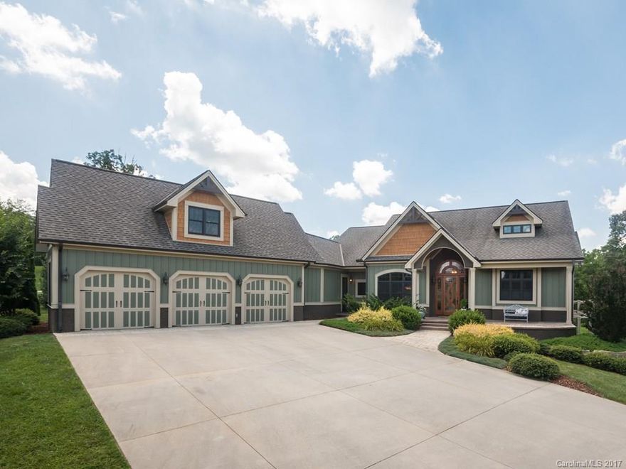 An ideal blend of modern mountain living & exquisite luxury detailing just 20 minutes to downtown Asheville. You are welcomed home through a gated entrance along a tree lined, pastoral drive. Covered deck & patio perfect for summer entertaining with year-round, peak-a-boo & winter mountain views. Main level master w/ his-and-hers closets. Bonus room & full bath over garage. Lower level offers 3BR/2BA, family room, wet bar, storage & more. Impeccably finished & maintained w/ lush landscaping.