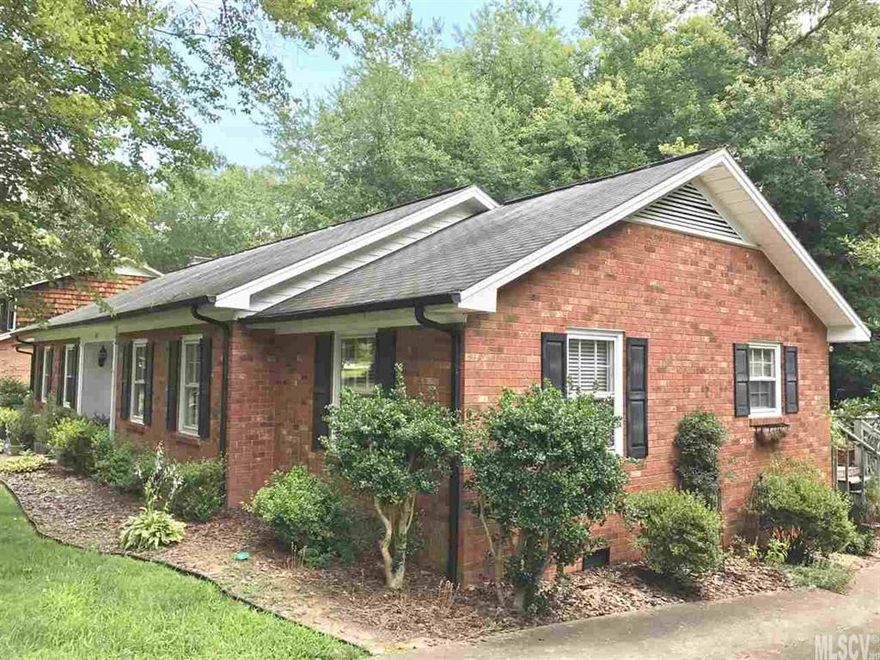 Beautiful full-brick, ranch home near downtown Hickory! This three bedroom, two bath home sits on a quiet street with a private backyard enclosed by mature landscaping. The home features hardwood floors, crown molding, a formal living and dining room, brick fireplace, built-ins and an oversized deck for entertaining!