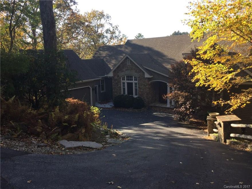 Custom built home with lots of space to entertain. Main level has large living room with stone fireplace and walls of glass to the outdoors. Large study off of family room with built ins. Large chefs kitchen with large breakfast area. Porches galore overlooking Burlingame Golf Course, large pond and mountains beyond. Large master suite with gas fireplace in master bath. Lower level has a large family room complete with wet bar and separate media room.