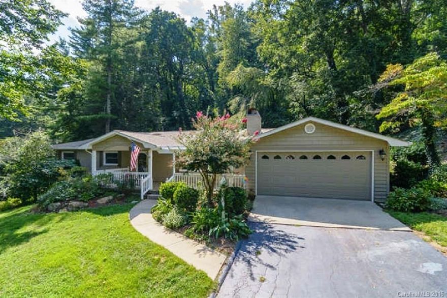 Welcome to Sherwood Heights in desirable N Asheville convenient to the Country Club of Asheville, downtown Asheville, & Beaver Lake. This home features main level living, 2 car garage on main, trees for privacy & lots of natural lighting.  Interior features include a living room with fireplace, formal dining room, open kitchen/family room concept w/natural gas fireplace & main level laundry.  The unfinished basement is perfect for a rec room/work shop. Enjoy the beautiful landscaping & gardens.