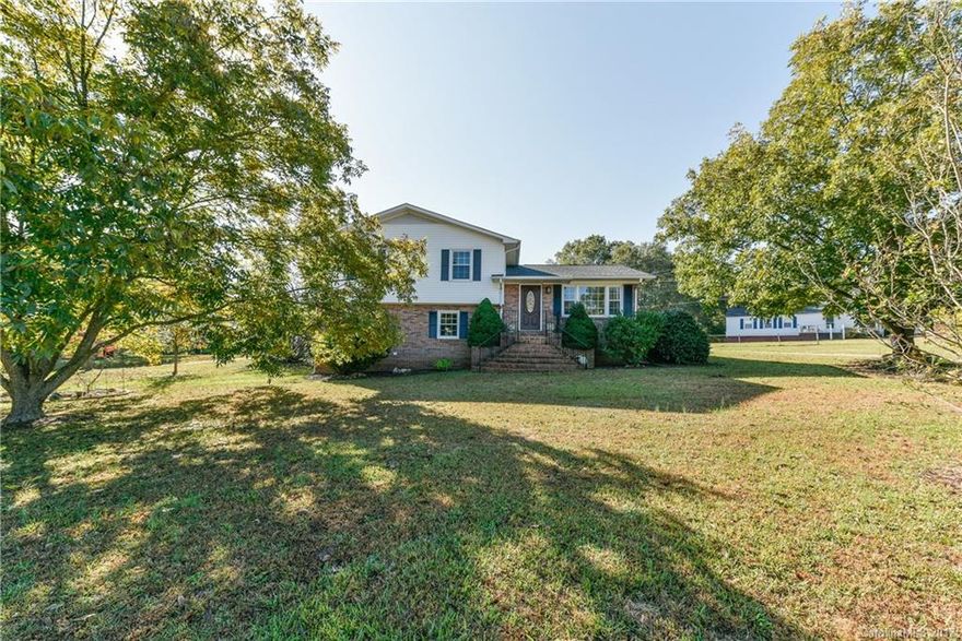 You have to see the updates in this house.  This house has been totally renovated and has gorgeous finishes.  Granite kitchen with stainless appliances including fridge and tile backsplash.  Replacement windows and doors.  Ceramic baths with custom finishes.  New carpet.  Terrific large, level lot to relax or entertain! Too many features to mention!  Come see this one now before it is gone.