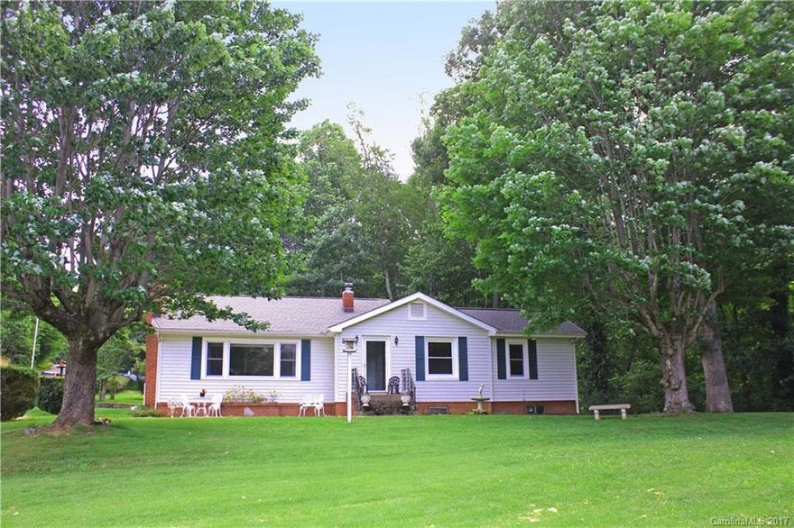 A blend of down home country living surrounded by absolutely gorgeous 1.77 acres with native landscaping. Lots of charm & character. Complete with long range mountain views and a lovely 3 bedroom, 2 bath home with oak flooring, fireplace and unfinished basement. A detached 2 car garage and a barn. Located 10 minutes from downtown Waynesville, 5 to the Blue Ridge Parkway, 20 to Sylva & 35 to Asheville.