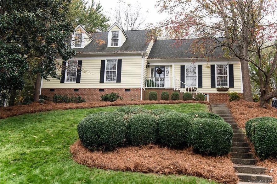 SO charming!! This home has hardwoods on main, custom light fixtures, remodeled kitchen with farmhouse sink/granite counters/custom backsplash, vaulted ceiling with wood beams, gas log fireplace,  spacious bedrooms, privacy fence, two storage sheds and a playhouse convey. Wrought iron gates open to parking pad in rear. Expansive backyard. HUGE walk-in attic storage! This home is tucked away in the neighborhood and does not back up to Carmel Road.