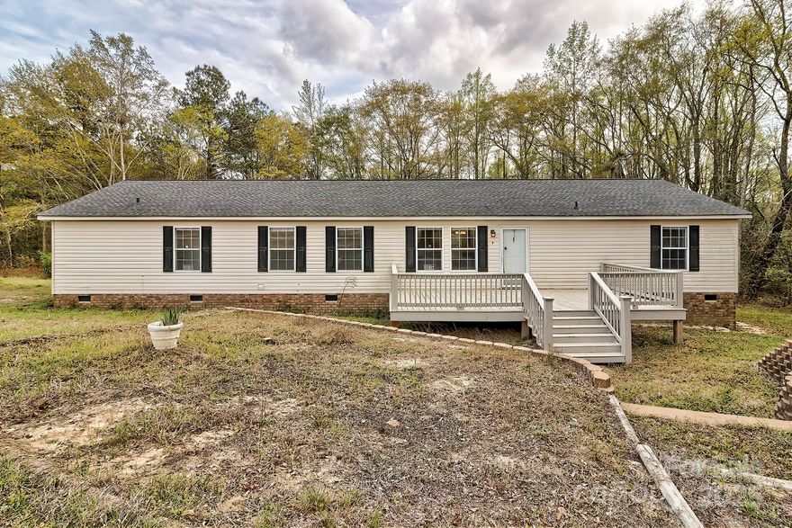 Let me introduce you to a beautiful home w/ 6.8 acres of land to enjoy in the country!  This 4 bedr., 2 1/2 bath modular home is spacious and ready for a new family.  All appliances convey (refrigerator, stove, dish washer) AND beautiful GRANITE COUNTER TOPS just sets the kitchen off!   This home looks like it's never been lived in.  Its about 7 miles from Kershaw, & less than an hours drive to Monroe, 20 minutes to Pageland.  If you like privacy & country life, you'll like this home!  CHECK IT OUT TODAY...I WORK WEEKENDS & EVENINGS & ILL SHOW FOR YOUR REALTOR, if necessary!