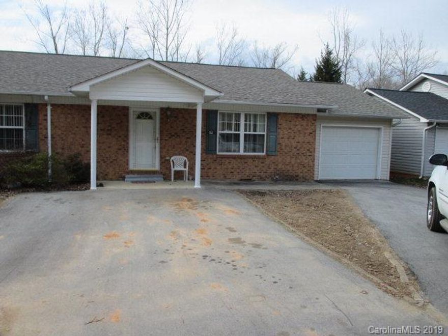 Great location, Pleasant Gardens area, convenient to town, I-40, schools and more.  This low maintenance brick/vinyl townhome is in excellent condition on .29+/- acres.  The home has approximately 1440 sf consisting of 2 bedrooms, 2 baths, kitchen w-custom oak cabinets, den/sunroom in addition to living room w/vaulted ceilings.  The home has a single attached garage, covered rear deck, nicely landscaped front yard.  The backyard that borders a small creek for your outside enjoyment.  This home is conveniently located near town, YMCA, hospital and I-40.