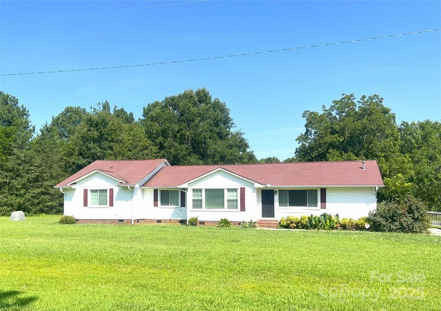 Rare find! 3-bed, 3-bath ranch home on 8 private acres. This residence offers abundant space with two dining areas, a kitchen featuring double ovens, plus a drop zone, laundry room, and office. The primary suite boasts vinyl flooring, natural light, and an ensuite with a walk-in closet. Enjoy a fully paved driveway and a large conveying shed in the backyard. Embrace serene country living with unparalleled space!