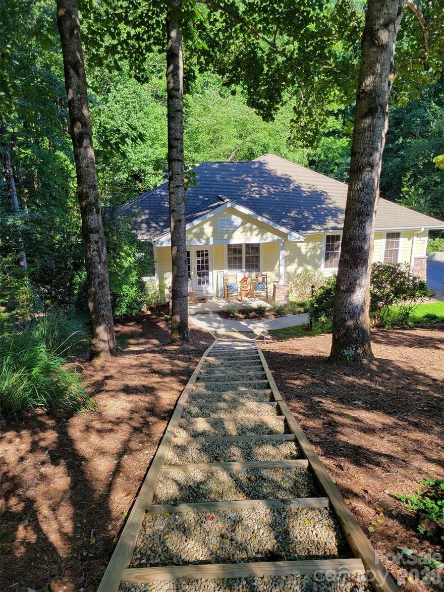 Beautifully kept home situated on cul-de-sac on private lot surrounded by nature. This property has been a part-time home by both homeowners. It has been meticulously maintained and current owners worked very hard to beautify the outside surrounding area of the home. A front walkway up to the street was added, trees close to home were removed, the complete yard was manicured and the backyard was upgraded with new lower level balcony and deck. The ground was raised to create a walk out deck with new grown grass. New LVT flooring was added to the lower level bedroom, family room and office/hobby room making the lower level more cozy and inviting. Main level boasts multiple upgrades including hardwood floors, open floor plan, plantation shutters, and custom blinds. Great room has vaulted ceilings and a floor to ceiling stone gas fireplace. Primary suite is spacious with access to deck and sunroom. Crawlspace is encapsulated including dehumidifier and radon system.