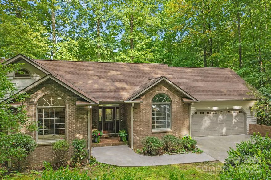 Nestled in the heart of the Pisgah National Forest and surrounded by breathtaking mountain views, this single-level 3-bedroom, 2-bath home offers the perfect balance of seclusion and convenience just minutes from Asheville’s vibrant dining, arts, and entertainment scene. Located within a private gated community, residents enjoy exclusive access to resort-style amenities including a pool, sports courts, and scenic paths, perfect for staying active or unwinding close to home. Step out your door and onto nearby hiking trails, or relax in your own private sanctuary. The home features a spacious, grassy backyard ideal for gatherings, play, or quiet reflection, with an elevated deck perfect for morning coffee, sunset dinners, or stargazing. Inside, enjoy high-end stainless steel appliances, granite countertops, and an open-concept layout designed for both comfort and entertaining. A versatile bonus room offers flexible space for guests, a home office, or creative pursuits. The walk-in basement adds even more possibilities, ideal for a rec room, home gym, or art studio. Schedule your showing today!
