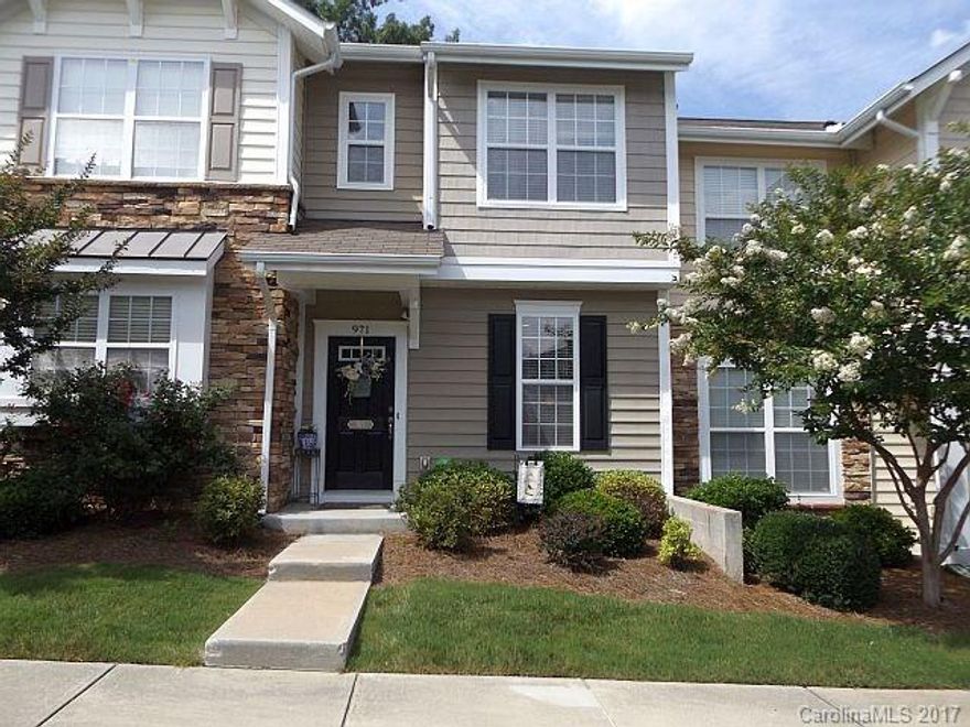 Cozy 2/1.5 townhome w/fenced private patio that backs up to tree line. Cherry cabinets in kitchen & black Maytag appliances, great room w/gas log fireplace & dining area combined. Master w/vaulted ceiling too! Close to everything, community pool & Fort Mill schools!