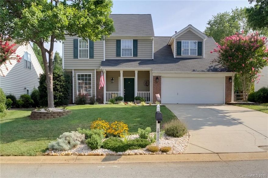 {Charming}This 4 bedroom, 2.5 bath home is wonderfully updated and waiting to be your home sweet home!  Inside you will find large, freshly painted rooms in the newest color and a layout that works for just about everyone. Whether you are relaxing out back on the covered deck overlooking your large private backyard after a long day or heading out for a stroll to grab coffee at the shops just down the street, this location can't be beat. Did I mention the pool is just steps away?