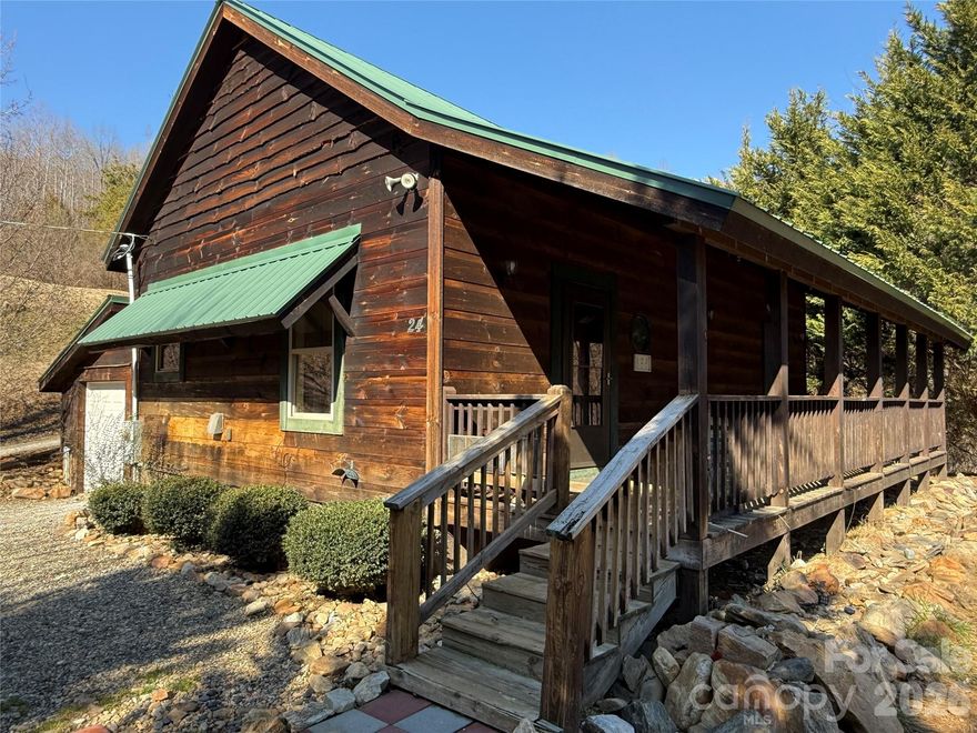 Experience the charm of mountain living at 24 Supooh Lane, a peaceful retreat tucked into the scenic landscape of Sylva, North Carolina. This inviting property blends privacy, comfort, and convenience, offering an ideal setting for full-time living, a second home, or an investment opportunity in the heart of Jackson County. The home welcomes you with a warm, open layout designed for easy living. Outdoor living shines here. A spacious covered deck overlooks mature trees and native mountain foliage, creating a serene backdrop for morning coffee, evening gatherings, or simply unwinding in nature. A short walk from the Savannah Community Park, with a pet walking trail, restrooms, kids playground, and a large picnic shed. Located just minutes from downtown Sylva, Franklin, and Western Carolina University, shopping, dining, and outdoor recreation, this property delivers the best of mountain living with everyday convenience.