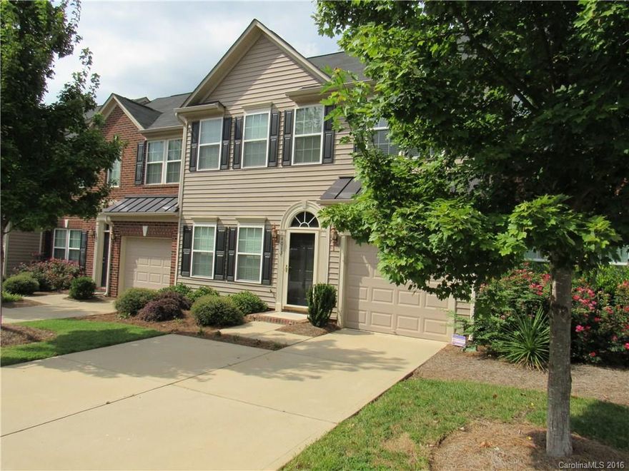 MUST SEE! WATERFRONT Townhome with beautiful details in a quiet neighborhood! Open floor plan and STYLE! Featuring: hardwoods, tray ceilings and columns. Kitchen has granite upgrades and rich cabinetry & pantry. Master Suite with his & her closets, extensive tile surrounds garden tub & shower. Fabulous PRIVATE Patio overlooking Pond and walking trail! Property has amenities galore! Shops, restaurants, gyms, grocery store and much, much more on property! Great Fort Mill School System!