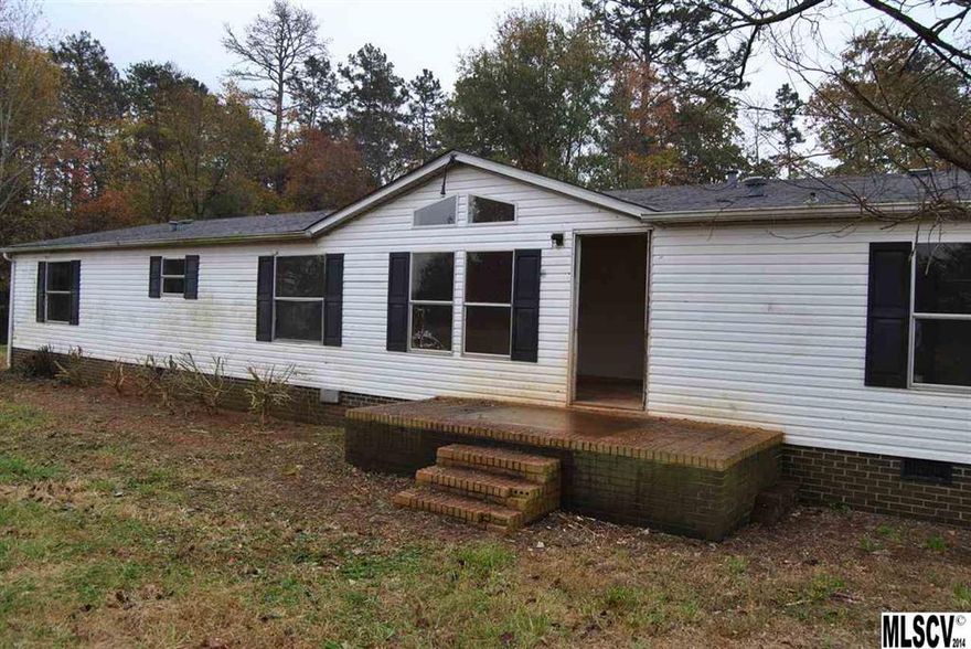 Double wide on brick foundation with well & septic. Property in need of renovations. Great for investor or buyer who has building background. Property on 2 acres. Only cash offers to be considered. There is a 4th room that has been used as a bedroom, the septic is permitted for a 3 bedroom home.