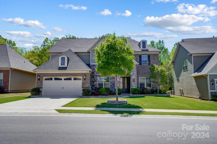 This immaculately maintained home checks all the boxes & more, on a rare private lot!  You'll love the open & airy floor plan with lots of natural light.  This home screams functionality!!  Greeted by an entrance foyer w/ an office & a formal dining room flowing into the cozy great room w/ coffered ceiling & stone fireplace, open to the kitchen w/ a large island, great for entertaining.  Pocket office sits behind the breakfast area, perfect as a work center, there's a guest bedroom on the main level.  Upstairs awaits a large loft perfect for a kids play area or hangout spot, Primary suite w/ large walk-in closet, 3 additional secondary bedrooms, 2 w/ walk-in closets.  3rd level is unfinished w/600+ sq ft to customize to your family's needs.  Fabulous covered back porch, Paver patio area w/ a fenced in backyard, great for entertaining outdoors & backing to trees making this home your families next oasis!  Enjoy the community pool & playground, Low SC Taxes & great Indian Land schools!