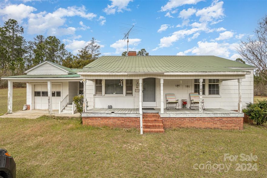 The home is of an unknown age. It has 2 large bedrooms, a living room, laundry room with one full bathroom. This home has a metal roof, heat pump and asbestos siding; it sits on 2 acres. Enjoy the front porch in this peaceful and quiet part of Kershaw County.