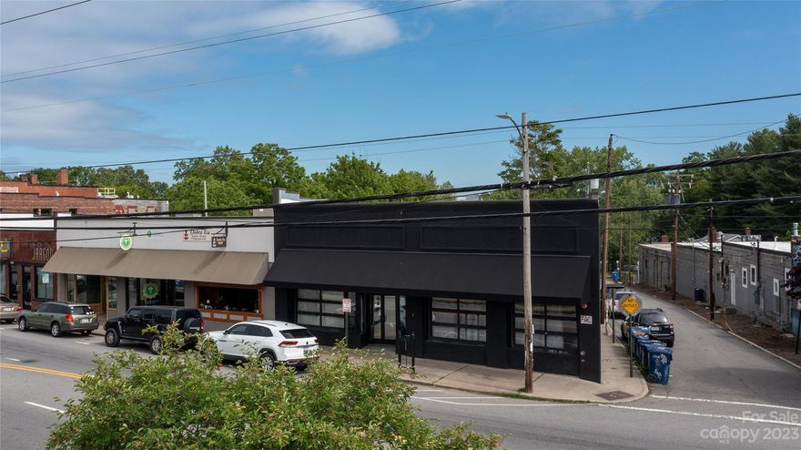 Rare opportunity to own a West Asheville landmark located on vibrant Haywood Road. Formerly The Mothlight music venue, 701 Haywood Road is now home to a thoughtfully curated blend of tenants including a special event venue and a nationally recognized restaurant. Built in 1924 and immaculately renovated in 2013 with new plumbing, new mechanical and electrical systems, a new roof, sprinklers and kitchen/bar infrastructure. It also maintains the historic integrity of the original building with refinished original hardwood floors, exposed beam ceilings and exposed brick walls. The lower level includes easily accessible storage and workshop space that could convert to additional rental income. Contact Listing Agent for showings. DO NOT DISTURB TENANTS.

Highlights
Fully Leased
Main Level: 3,810 SF
Lower Level: 3,495 SF
Some equipment included