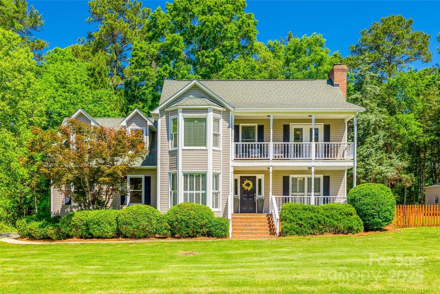 Welcome to this beautifully updated 4-bedroom, 2.5-bath home on nearly 2 acres in an established neighborhood filled with towering trees. Spend your summer days lounging by the 36' x 17' in-ground pool or entertaining guests in the expansive backyard oasis, complete with a powered pool shed, firepit area covered deck & screened porch overlooking the double-fenced yard. Car enthusiasts & hobbyists will appreciate the abundance of parking & workspace, including 2-car attached garage with utility sink, detached workshop/garage, 2-car detached carport & an RV carport nestled among the trees. Inside you'll find a spacious updated kitchen, beautiful new flooring throughout the main level, new carpet upstairs & an updated guest bathroom. The primary suite is a true retreat with a walk-in closet, private balcony & a luxurious bath boasting a freestanding soaking tub. Close to Lake Wylie & Rock Hill shops & grocery. This home offers peaceful country living with modern amenities.