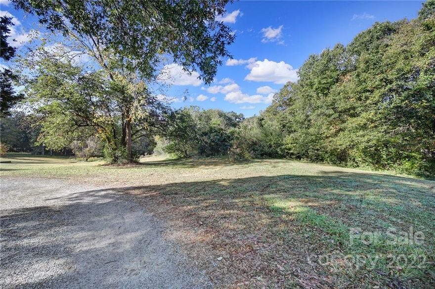 Please note updated attachement from Gaston County for Waste Water System Improvement!!!    

!!!!! 3% Seller Financing Available!!!!!!

Solitude and sanctuary await you just north of quintessential Mt Holly. Come enjoy this sprawling 1.87acre parcel of land located less than 30 Minutes from Bank of America Stadlum! This semi forested lot offers countless possiblities for the imaginative homesteader in all of us. Seller financing available. Bring your buyers and call today to learn more or set up a tour.   Please do not attempt to drive into the meadow, park to the right of the listing sign.