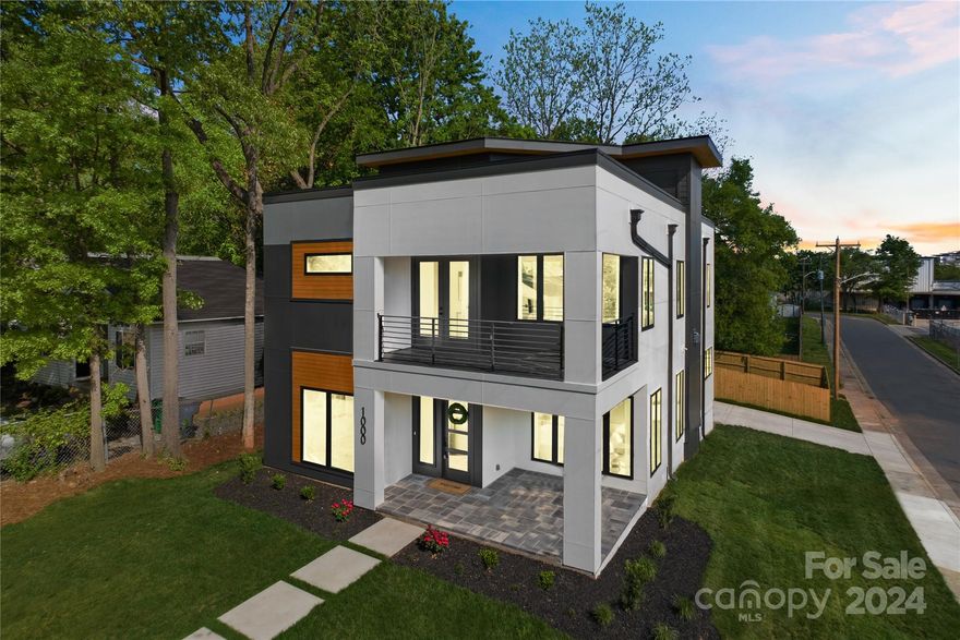 Beautiful and elegant Modern single family home with no detail spared available now! Brand new construction centrally located in the Belmont neighborhood, between Plaza Midwood and NoDa close to Optimist Hall. Situated on a picturesque corner lot with panoramic city views from the rooftop terrace. Meticulously designed interior with modern chef's kitchen, spacious scullery, and open concept living separated by a see-through double sided gas fireplace. Elegant plumbing and lighting selections in the FOUR full bathrooms, primary bath comes with a huge tub-shower combo that will be sure to impress. The wow factor on this one is easily the sprawling rooftop terrace with a bonus room on the third floor that includes a wet bar area for entertaining. Comes complete with a fenced in backyard and a large two car garage. KO Construction knocked it out of the park with this one!