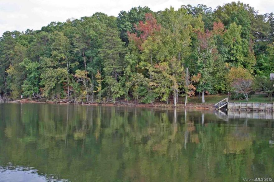 Lake Wylie waterfront community in the Fort Mill School District!. Dock in place on this 0.84 acre wooded waterfront lot. Bring your own builder or use one of ours to build your lakefront home on Lake Wylie. Convenient to Baxter Village and I-77. Tega Cay residents recieve a discount on golf, tennis and swim clubs.