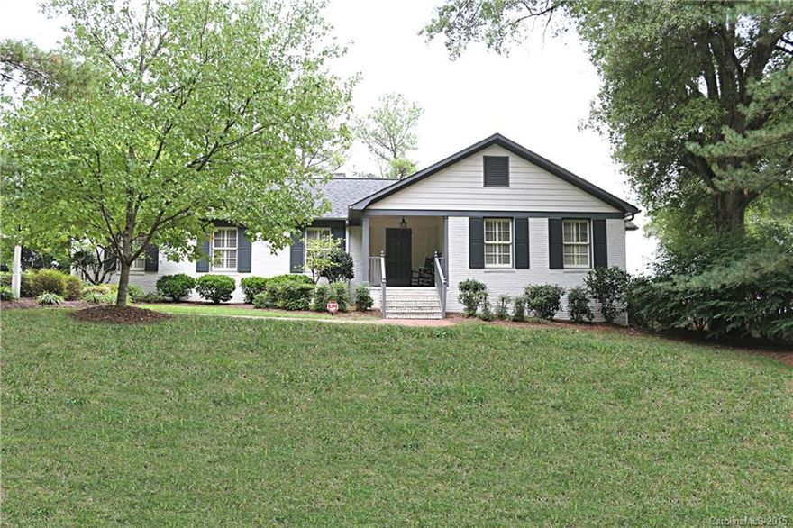 Beautiful and charming brick ranch. 5BR/3BA home on nice lot conveniently located to town, schools and so much more! This home is in move-in condition and features screened porch, built-ins, wood floors, great rec room, dressing area in owner's suite and nice size rooms throughout. Floor plan offers flexibility to potential buyers with finished basement. Great curb appeal, shutters on home. Call today for an appointment. Don't miss out on this beautiful home!