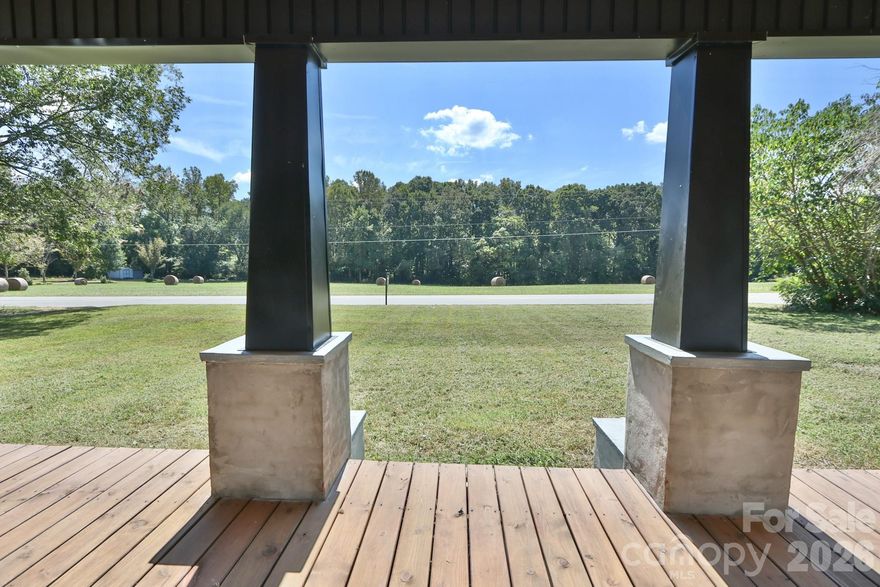 RENOVATED AND MOVE IN READY! This gorgeous 3BR/2BA home on .95 acres offers modern updates and timeless charm. Enjoy relaxing on the large front porch before stepping into the open floorplan featuring a spacious living room w/a wood-burning fireplace, LVP flooring, crown molding, and neutral paint w/brushed gold accents throughout. The home also includes a separate dining room and a fabulous kitchen w/granite countertops, tile backsplash, abundant cabinet space, and brand-new stainless steel appliances, including a refrigerator. The primary suite boasts a walk-in closet and a spa-like en-suite bathroom w/dual sink vanity and walk-in shower. Additional bedrooms each feature walk-in closets. A dedicated laundry area and a mudroom off the 2-car garage add to the home’s functionality. Add'l 2025 improvements include a freshly dug well, new heat pump, roof, windows, vinyl siding and gutters, and a recent septic inspection. You cannot miss this opportunity.  Schedule a tour today!