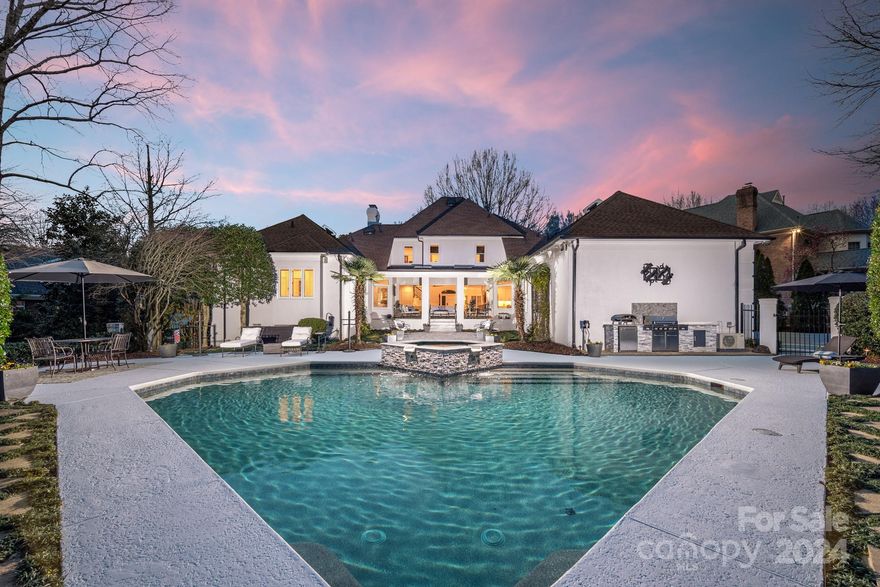 Discover the epitome of a resort-inspired lifestyle in Charlotte’s prestigious heart! Nestled within the desirable Giverny neighborhood, just moments from SouthPark, this distinguished property masterfully fuses opulence, modern design, and unparalleled outdoor enjoyment. Adorned with sublime stucco, this impeccably kept
executive residence is situated on a .59-acre lush sanctuary. Featuring hardwood flooring throughout, it boasts dual owner suites, a home theater with a nearby wet bar, and expansive windows that bring the allure of the serene backyard indoors. Beyond its beauty, the home is practical too, offering custom closet solutions, ample storage, and versatile spaces for all. This exceptional estate, cherished and impeccably maintained, eagerly awaits its next fortunate owners.