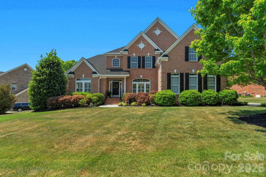 Nestled in the sought-after Weddington Trace Estates, this stunning full-brick home sits on a lush & wooded .51 acre lot. Timeless Elegance throughout this open concept home with everyday comforts & modern touches. Boasting over 4,000+ sq. ft. w 4 bedrooms, 3.5 baths, a bonus/media room/5th bedroom & exceptional outdoor living space perfect for entertaining or unwinding in serene privacy.

Step through the grand 2-story foyer, where elegance flows effortlessly into the formal dining room, a versatile sitting room/office, and a soaring 2-story great room. This inviting space features custom built-ins, coffered ceiling, gas fireplace, and a breathtaking wall of windows adorned with plantation shutters that bathe the room in natural light.

The gourmet kitchen is a chef's dream, showcasing professionally painted linen-colored cabinetry, an oversized black granite island, a butler's pantry, and a custom walk-in pantry. The adjoining morning room is drenched in sunlight, offers a peaceful spot to enjoy your morning coffee while overlooking your private backyard—perfectly suited for a future pool, should you desire. 

The main-level primary suite is a retreat in itself, with a tray ceiling, a cozy sitting w vaulted ceiling and a luxurious ensuite bath featuring dual custom closets. Upstairs, you'll find three spacious secondary bedrooms, each with private bath access, and a generous bonus room or 5th bedroom ready to adapt to your lifestyle.

Retreat outside and discover a vaulted covered porch and expansive deck, perfect for hosting summer gatherings or relaxing with a book while surrounded by nature. This amenity-rich community offers something for everyone, including a Clubhouse, Jr. Olympic pool w splash pool, Stocked pond w dock, Pickle ball Court, Tennis courts, Game courts, and scenic walking trails.

Don’t miss the chance to call this exceptional home your own—schedule your private showing today! New roof in 2026, Plantation shutters throughout most of main level, 3 car garage. & meticulously maintained.