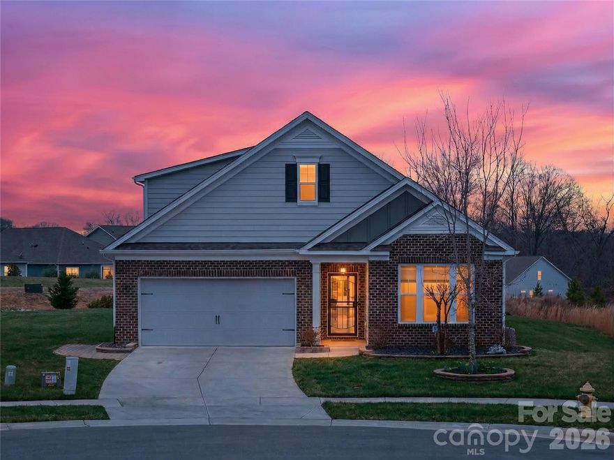 Tucked away on a quiet cul-de-sac in a prime Mooresville location, this beautifully maintained 1.5-story home blends thoughtful design, custom details, and low-maintenance living. With the majority of living space on the main level, it offers both comfort and flexibility for the way today’s buyers want to live.

The main floor features a spacious primary suite retreat, complete with updated mirror and lighting fixtures in the bath, along with a generous walk-in closet. A secondary bedroom and full bath on the main level provide ideal space for guests, while a dedicated study/office offers privacy for working from home.

At the heart of the home, the kitchen impresses with a large island with seating, a stunning custom-designed walk-in pantry with built-in storage, and a laundry room just off the kitchen complete with a utility sink. Hardwood floors flow throughout the main living areas, and the inviting fireplace creates the perfect gathering space for cozy evenings.

Upstairs, a loft provides flexible bonus living space alongside a third bedroom and full bath — ideal for guests, hobbies, or a private retreat. Walk-in attic storage adds exceptional functionality rarely found in homes of this size.

Step outside to enjoy a screened-in porch overlooking a serene, wooded backdrop — the perfect setting for morning coffee or relaxing evenings. Updated landscaping and flower beds enhance the home’s curb appeal, while the two-car garage offers additional storage space behind.

The HOA covers lawn maintenance and full-property irrigation, creating truly easy living. Community amenities include a pool, dog park, walking trails, playground, and recreation area — all within a highly desirable Mooresville location close to shopping, dining, and Lake Norman access.

A rare combination of privacy, thoughtful upgrades, and turnkey convenience — this home is ready to welcome its next owner.