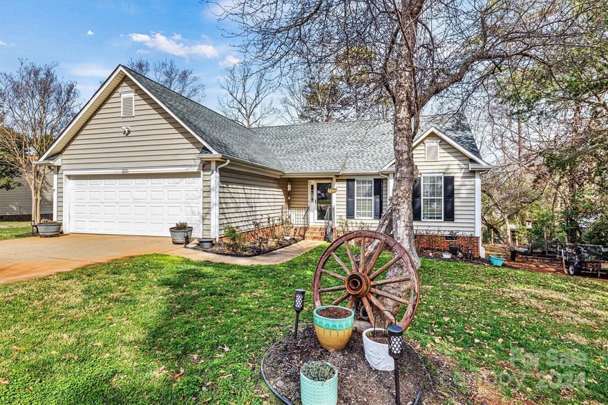 Step inside and be greeted by the warmth of this 3-bedroom, 2 full-bath home designed with a split bedroom floorplan to maximize privacy and functionality. The open concept seamlessly connects the kitchen to the family room, creating an ideal space for entertaining or relaxing with family and friends. Unwind and relax by the cozy gas fireplace on those chilly evenings. Situated on a .47 acre lot on a cul-de-sac road, this property provides ample room for outdoor enjoyment. Experience the tranquility of nature and the winter water view from your screened-in newly built covered deck, perfect for a morning coffee or an evening with friends. Home has been thoughtfully updated, with newly painted interior, new bathroom, new back deck in 2020 and screened in area 2023, granite countertops in 2021, vinyl plank flooring in 2023. Down the road from public boat launch, playground and water park, disc golf, and track at Beatty's Ford Park. Close to highway 16 and 73, shopping and restaurants.