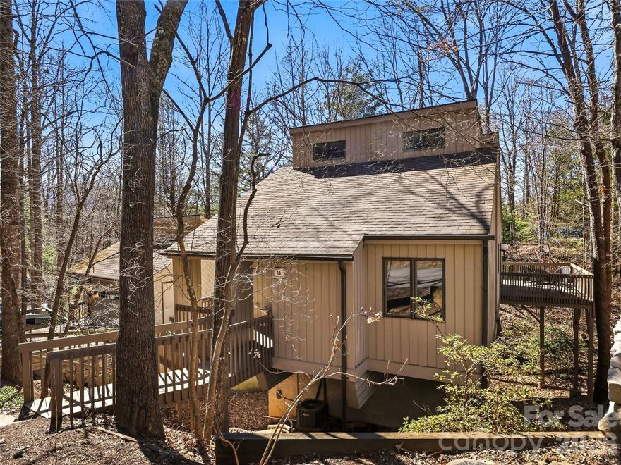 Perfectly positioned in East Asheville, this stand-alone condominium offers the rare combination of privacy, flexibility, and low-maintenance living—just minutes from Downtown Asheville and the scenic Blue Ridge Parkway.
The main level welcomes you with an inviting open floor plan filled with natural light and designed for effortless everyday living. The kitchen features granite countertops, stainless steel appliances, and a pantry, flowing easily into the living and dining areas. Just beyond, a generous wraparound deck expands the living space outdoors—ideal for morning coffee, evening gatherings, or simply enjoying the peaceful setting.
A bedroom and full bath on the main level provide convenience for guests or the option for one-level living. Upstairs, the loft space offers a versatile bonus area—perfect for a home office, reading retreat, or quiet sitting room.
The lower level features a private second bedroom suite complete with a walk-in closet and its own balcony, creating a comfortable and secluded retreat for guests or extended stays.
One of the home’s standout features is the detached two-car garage with a full basement below, offering exceptional space for storage, a workshop, hobbies, or outdoor gear—a rare and valuable amenity.
Residents enjoy access to community amenities, including tennis/pickleball courts and a swimming pool, which add recreational and lifestyle appeal to this welcoming community.
With its thoughtful layout, abundant storage, outdoor living spaces, and highly convenient location, this home offers easy access to Asheville’s vibrant downtown, shopping, dining, and endless outdoor adventures along the Blue Ridge Parkway. A wonderful opportunity to enjoy comfort, convenience, and community in one of Asheville’s most desirable areas.