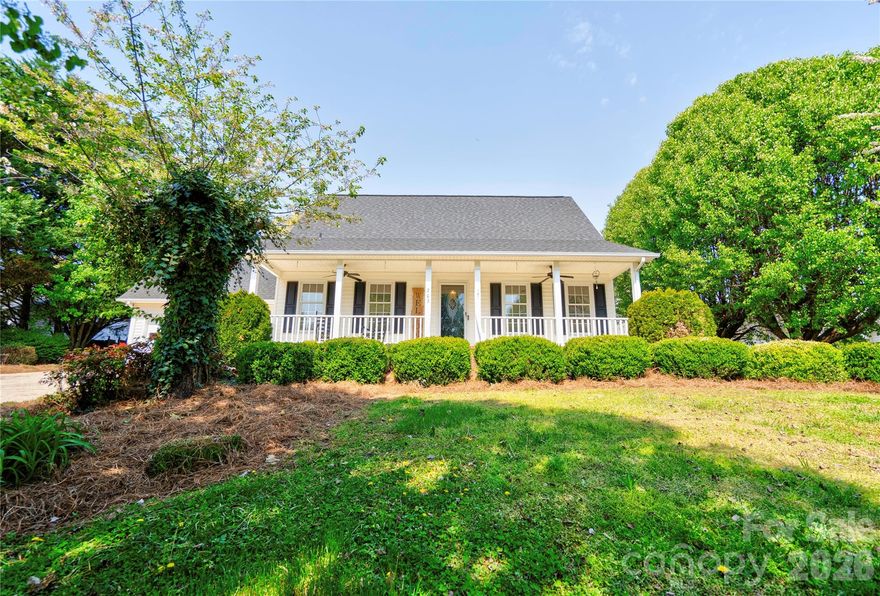 Beautiful home located in an established Cherryville neighborhood offering space, comfort, and great functionality. This 4-bedroom, 3 full bath home features a spacious kitchen with hardwood custom cabinetry, a large island, stainless steel appliances, and an oversized walk-in pantry, perfect for everyday living and entertaining.  The dining room showcases a brick wood-burning fireplace with custom built-ins.  Large living room, great for entertaining.  The main level includes one bedroom, a full bath, and a convenient laundry room.  Upstairs, you’ll find three additional bedrooms and two full baths, including a generous primary suite with a large walk-in closet. Additional highlights include an oversized garage, covered front porch, and a covered rear porch overlooking the pool area—ideal for relaxing or hosting guests.   Also features a storage building and covered area for grilling.  Beautifully landscaped lot completes this must-see home!