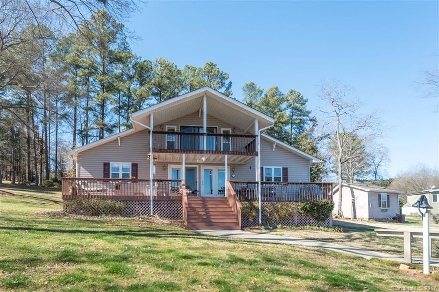 Gorgeous views of the main channel and nestled in a cove with a large, gently sloping lot on a quiet street, this is immaculate waterfront home a definite must see! This transitional floorplan is very open. Master Suite with private waterside deck comprises the entire second level. Pier with floating dock, boat lift, JetSki lift, and second level sundeck. Workshop wired. Fully rip-rapped Seawall. Low SC taxes and award-winning Clover Schools.