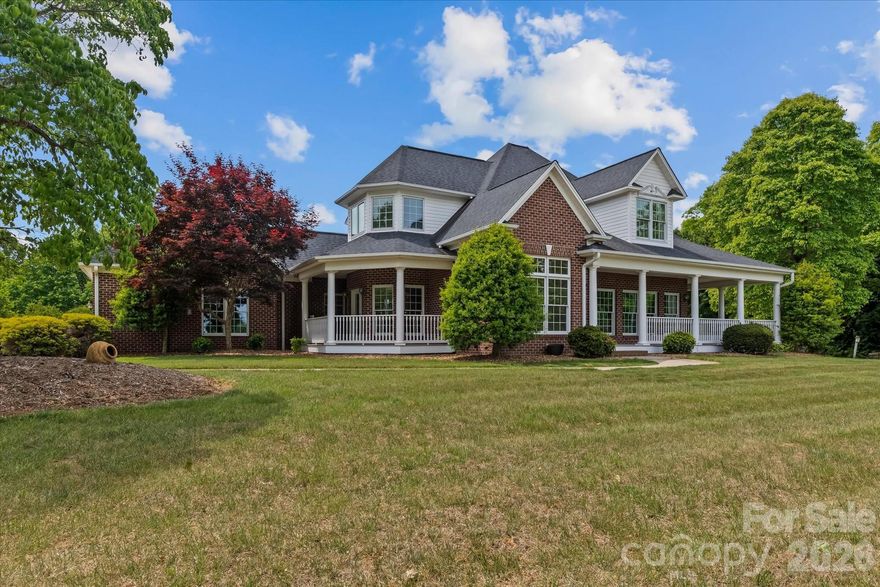 Located in the gated community of Lithia Ridge in the Brushy Mountains, this custom brick home offers privacy, elevation, and long-range multilayered mountain views across 2.38 acres. Designed to capture the surrounding landscape, expansive windows and skylights provide natural light and scenic views from much of the home.

The main living area features hardwood flooring, granite countertops, and a gas log fireplace. Outdoor living includes a covered front porch and a screened-in back porch, both positioned to enjoy peaceful mountain views.

The finished basement provides additional flexible living space ideal for a recreation room, home office, or guest area. A two-car main-level garage, along with a basement garage and workshop, offers ample storage and workspace.

Conveniently located near shopping and dining, this property combines gated mountain living with accessibility and impressive long-range views.