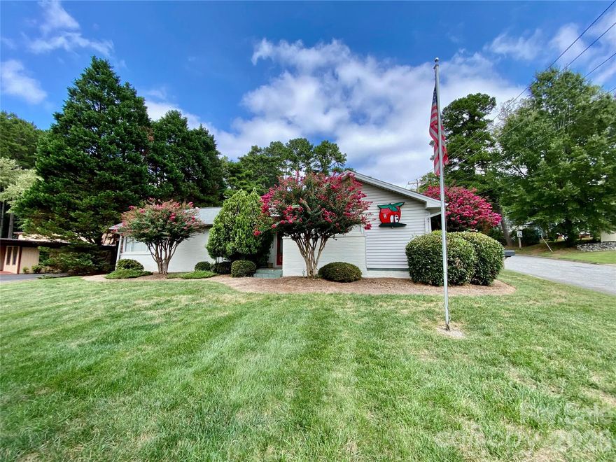 Property is currently zoned RMX and per Zoning, they will allow a change to Residential if a potential buyer should wish to purchase with the intent of converting it later to a Residence.  The property has the potential to be used as a 3 bedroom 1 1/2 bath residence with an office and additional flex space.  It was previously used as a Real Estate Office.  The property currently comes with desks, chairs, copier machine, filing cabinets (several are fire proof), sealed fireplace, ample parking spaces, phones and communication system.  There is a small electric hot water heater under the kitchen sink.  It also comes with a working alarm system.  This listing is also listed as a duplicate listing in Commercial as MLS#4293477 because it is Zoned RMX.