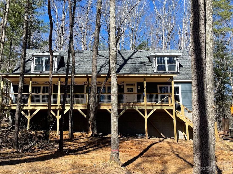 Welcome to Cascade Ridge, one of Western NC's newest communities! Built in a modern farmhouse aesthetic, this home offers an expansive front porch, spacious rear deck, hardboard siding, and mountain views. The interior boasts an open floorpan, three bedrooms, two baths, kitchen island, and mudroom. There is also room to grow and let your DIY imagination come alive with an unfinished upper level with 750 sqft. of space and stairs in place to connect. Located in Fairview, just a short drive from downtown Asheville, independent coffee shops, local breweries, and eclectic restaurants will be some of your new and closest neighbors! The neighborhood allows short term rentals. Call to schedule your appointment!