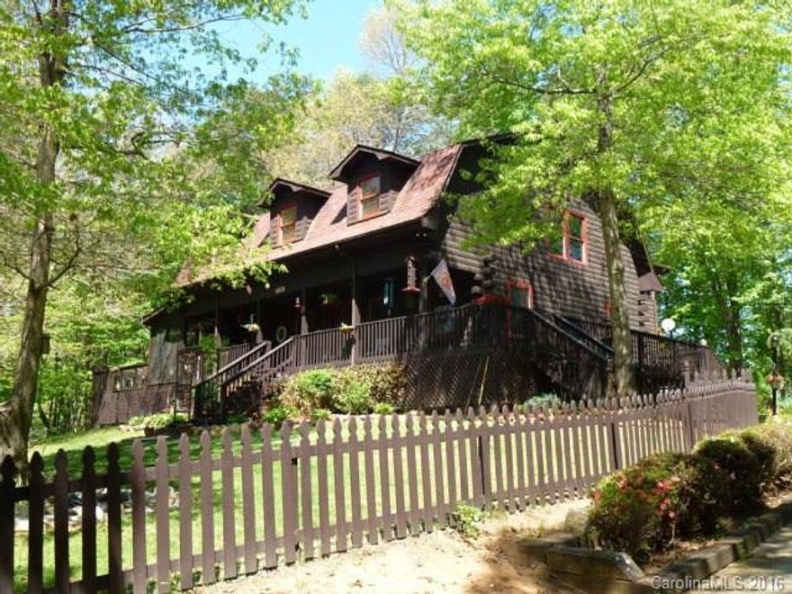 Plenty of house for the whole family! This nearly 3600sft log home features a large open kitchen w/tile counter tops, a spacious family room w/beautiful tile floors & a wall of stone fireplace & hearth! Upstairs is your large master with his & hers walk in closets & a beautiful; walk in tile shower in the master bathroom! The finished basement features a full apartment w/kitchen, living room, full bath & huge bedroom. City amenities without the taxes! A MUST SEE!