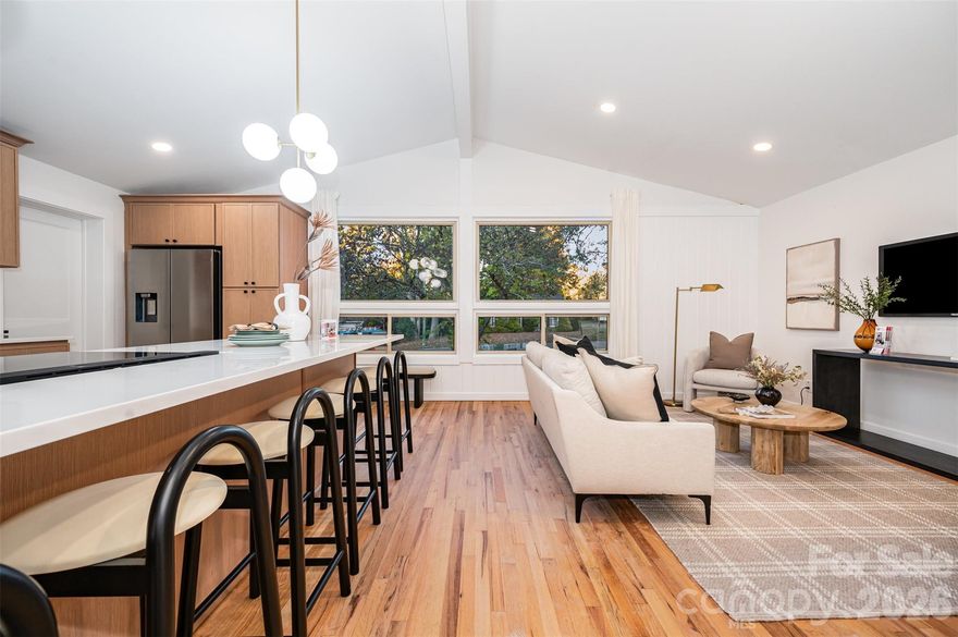 Step inside this renovated mid-century ranch and discover a thoughtfully designed interior centered around a stunning oversized kitchen island perfect for everyday living and effortless entertaining. The kitchen opens seamlessly to the living and dining areas, creating a bright, inviting open-concept layout enhanced by a convenient butler’s pantry and high-end finishes throughout. The spacious primary suite features an updated en-suite bath with a sleek curbless shower, while the hall bathroom showcases elegant marble finishes. Restored oak hardwood floors run throughout the home, adding warmth and timeless character. Outside, an oversized detached shed offers exceptional versatility; ideal for a home office, art studio, playroom, workshop, or additional storage. Blending modern updates with classic mid-century charm, this move-in-ready home is thoughtfully updated and priced to sell. Don’t miss the opportunity to make this exceptional property your own.