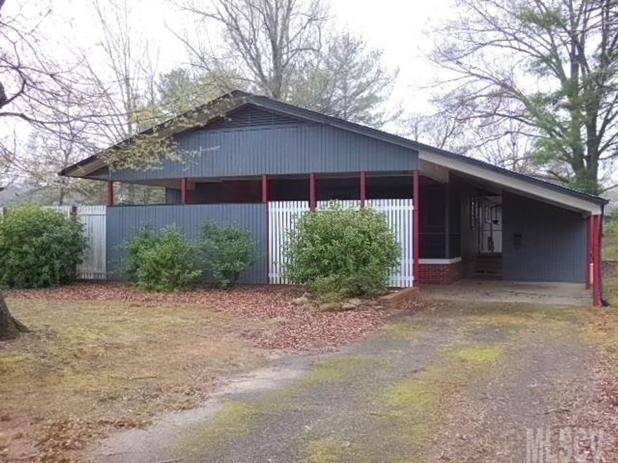 This Jim Sherrill designed home masterfully blends the open, mid-century-modern living space with privacy for the 5 bedrooms and 3 baths. Features include living room with brick fireplace & wall of windows, dining area, kitchen with pine cabinets & bar seating, large closets & storage spaces, built-in cabinets, tiled baths, covered patio with barbecue area, screened porch & quiet cul-de-sac location.