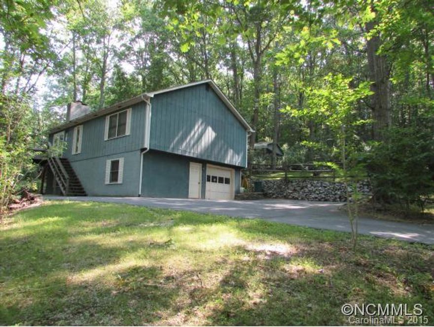 Conveniently nestled on wooded lot. Cathedral ceilings, Hardwood Floors, Fireplace, Open Floor plan, Nice Big Deck on Front of House and Home warranty Included. Family Room and Bonus Room with free standing gas log stove. single car garage in basement. This house is the perfect getaway without leaving the city.