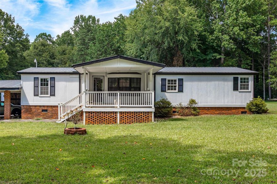 Well-maintained 3BR/2BA manufactured home on 2.06 private acres with incredible workshop space! Interior features approx. 1,398 sq ft of living area. Recent improvements include: new HVAC (2021), new gutters & windows (2022), fresh asphalt driveway (2024), and new bedroom flooring (2025). Roof replaced in 2013. Outside, enjoy a 36x36 3 phase workshop with three 10x9 roll-up doors, separate 12x24 shop with attached lean-to, and a 2-car detached carport. No HOA!