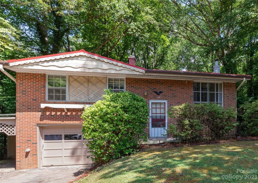 Come check out this charming split-level house that boasts 3 bedrooms and 1 1/2 bathrooms in Candler. Home spans 1,409 square feet, offering comfortable living quarters and versatile amenities including city water. Nestled on a generous .62-acre lot that adjoins the included, additional .98-acres. This property presents ample outdoor space for relaxation, recreation, or possible additional building space for investors. One of the highlights of this home is the bonus room, which can be customized to suit your needs- whether it be a home office, a playroom, or an additional entertainment space. This beautiful brick home features a high quality metal roof. It also includes a convenient garage as well as a carport with an attached 220 square feet of additional storage space. Don't miss your opportunity to make this house your home. This home is sold separately without the adjacent lot under MLS#4052744 as well as the land is being sold separately under MLS #40547